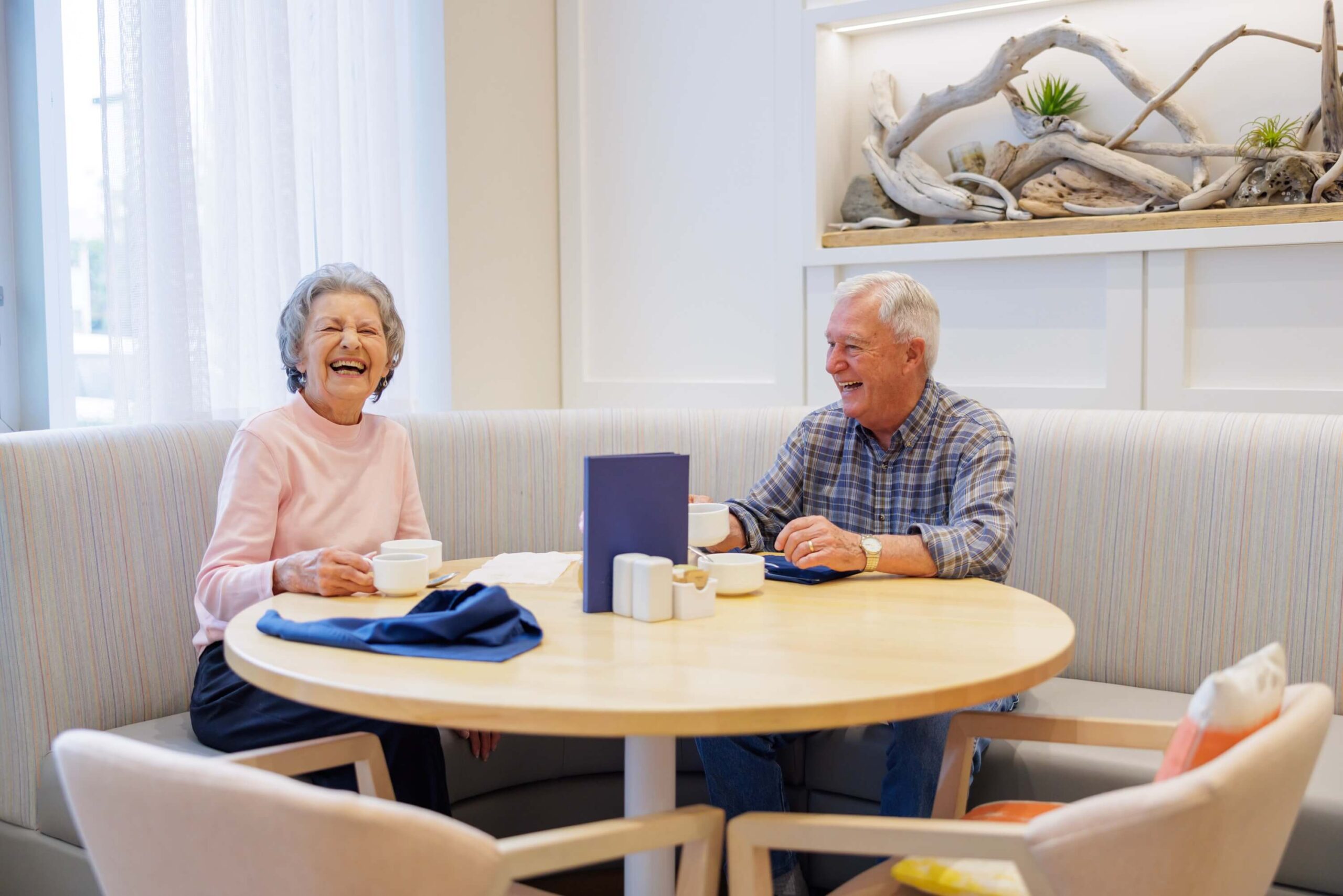 Two PARC's senior residents having tea or coffee together. Independent Senior Living Community.