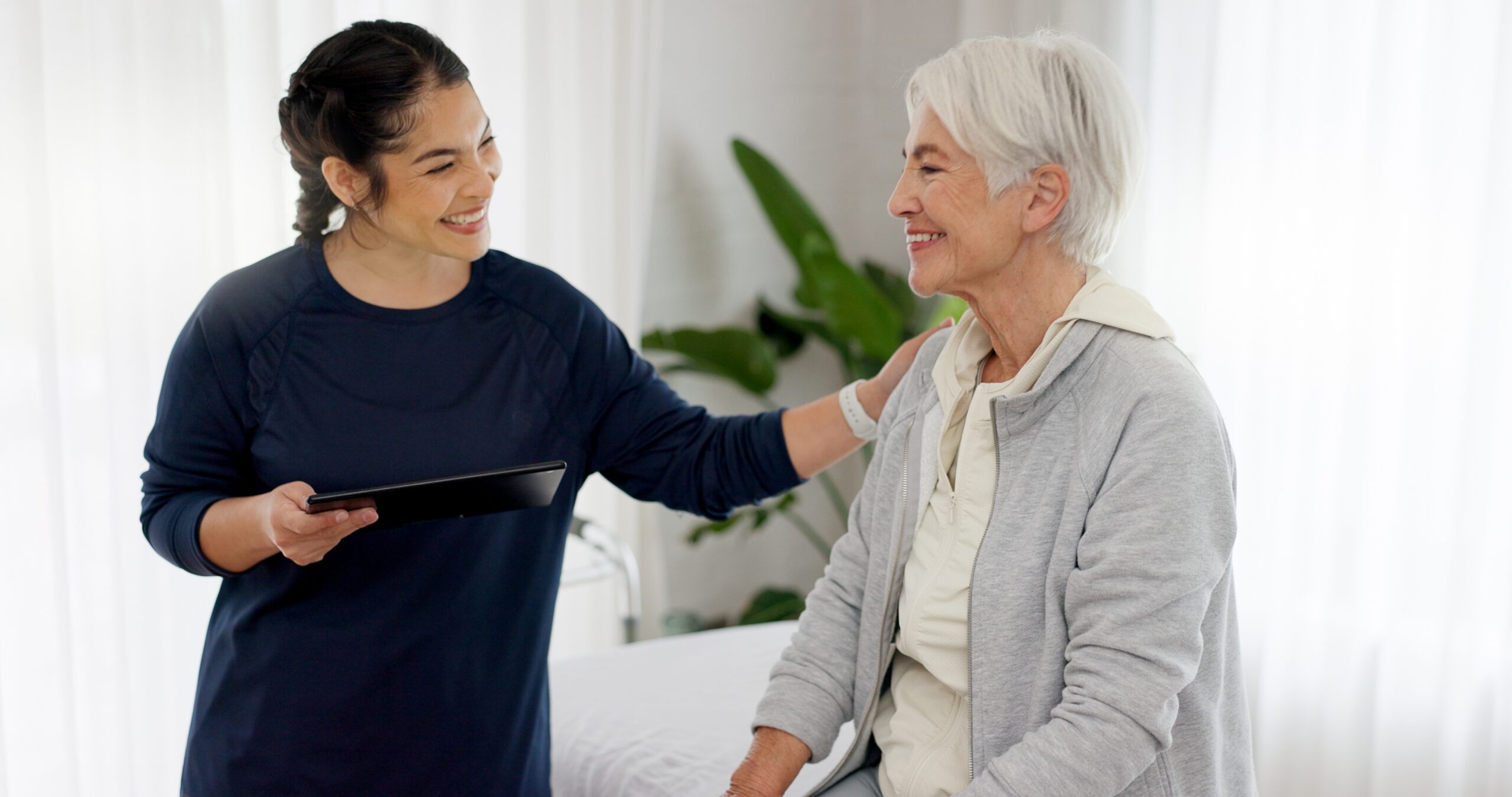 A resident with a PARC's wellness consultant. Independent Retirement Community.