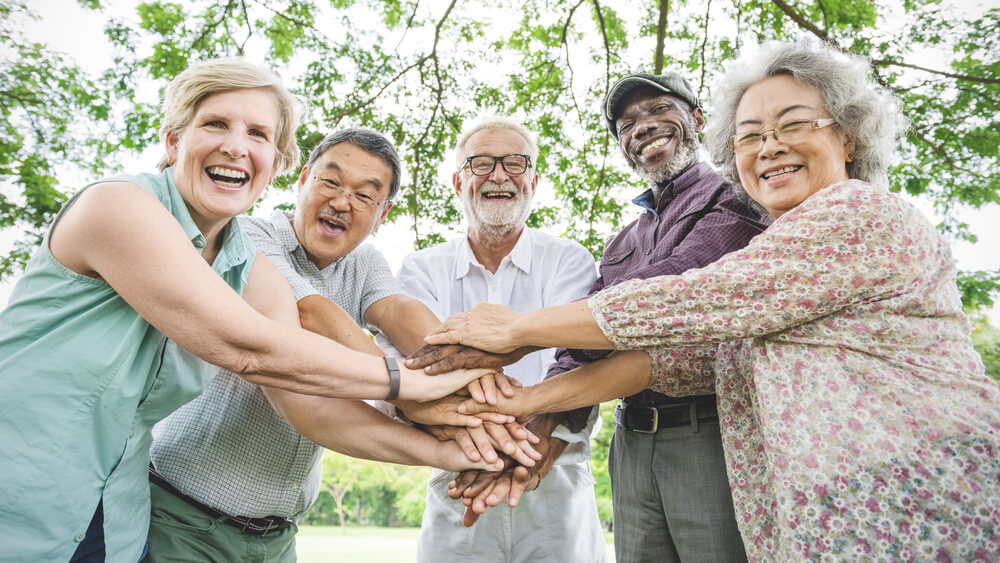 A group of smiling PARC Living residents