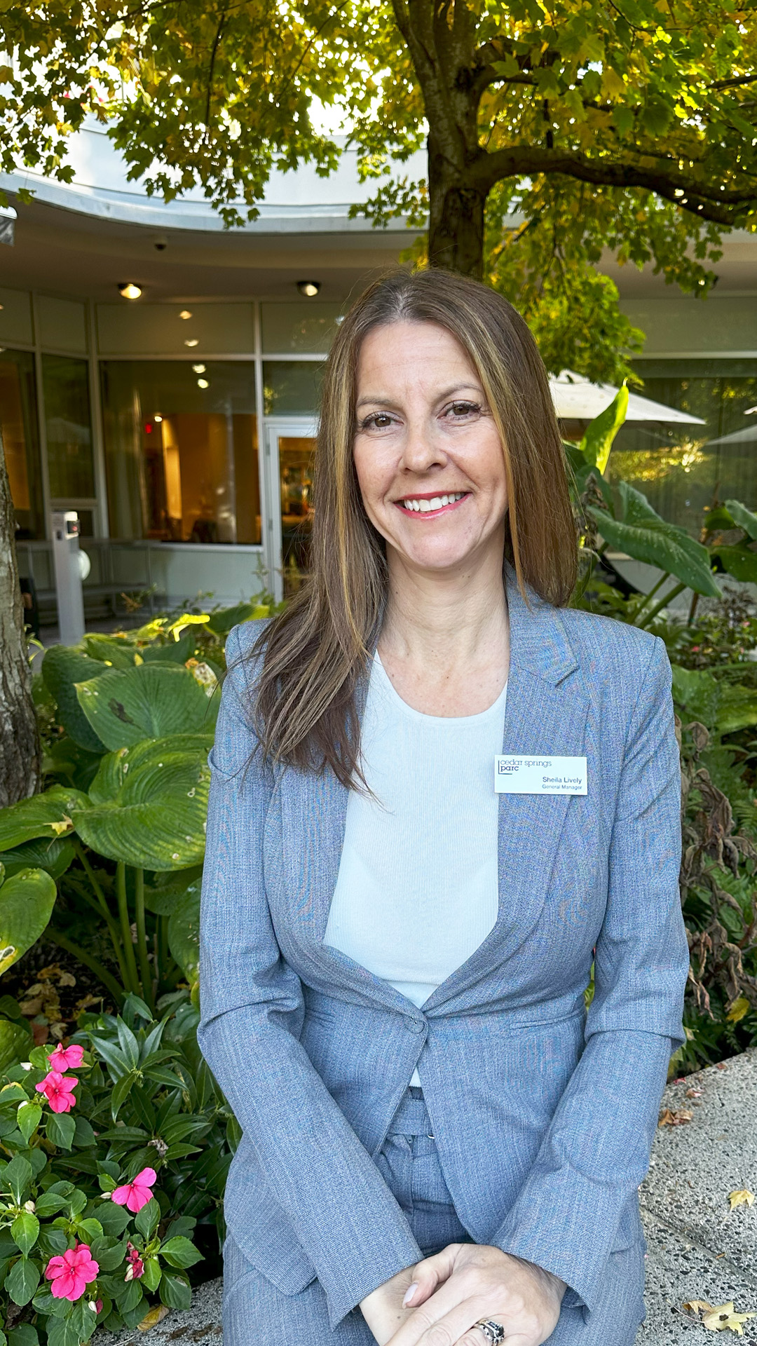 General Manager Sheila Lively sitting in Cedar Springs PARC garden in North Vancouver
